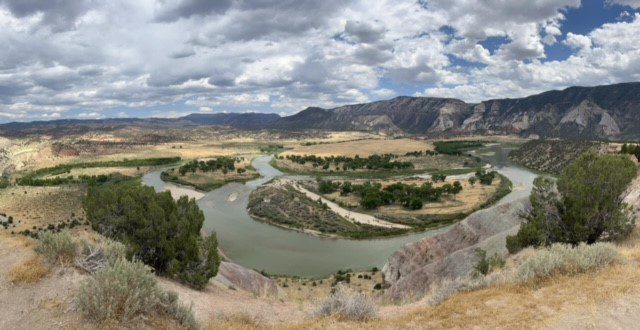 Birds eye view of a lake in and mountains